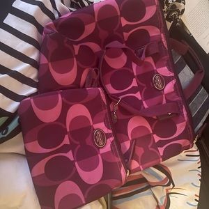 Coach  TWO ITEMS  Getaway Collection magenta nylon bag with matching makeup bag.